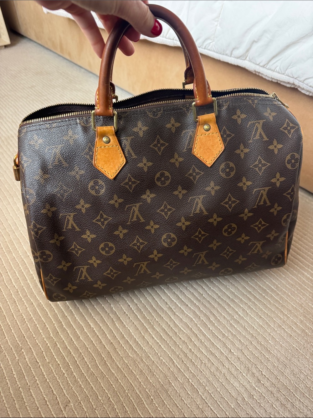 Authentic Louis Vuitton Monogram Canvas Speedy 35 Handbag in Brown and Tan.